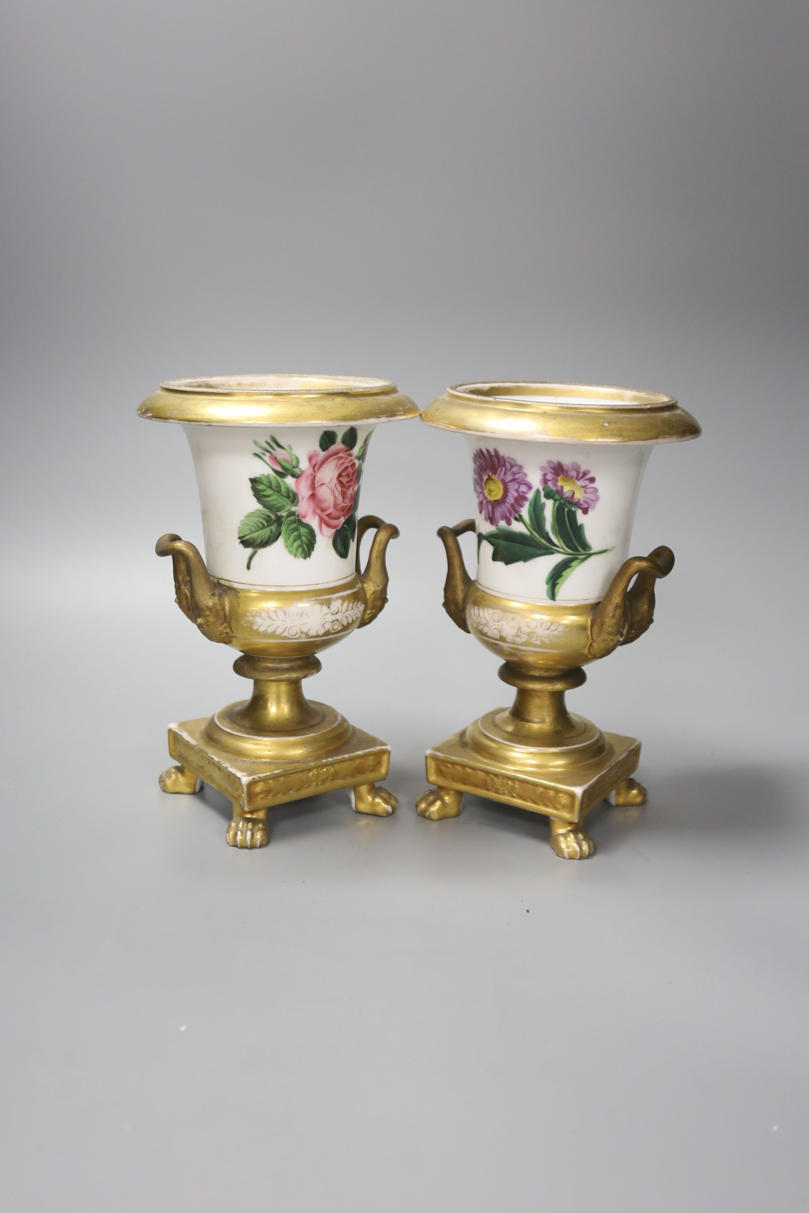 A pair of Paris porcelain flower painted campana urns, with receipt from 1928 £3.10, 20cm